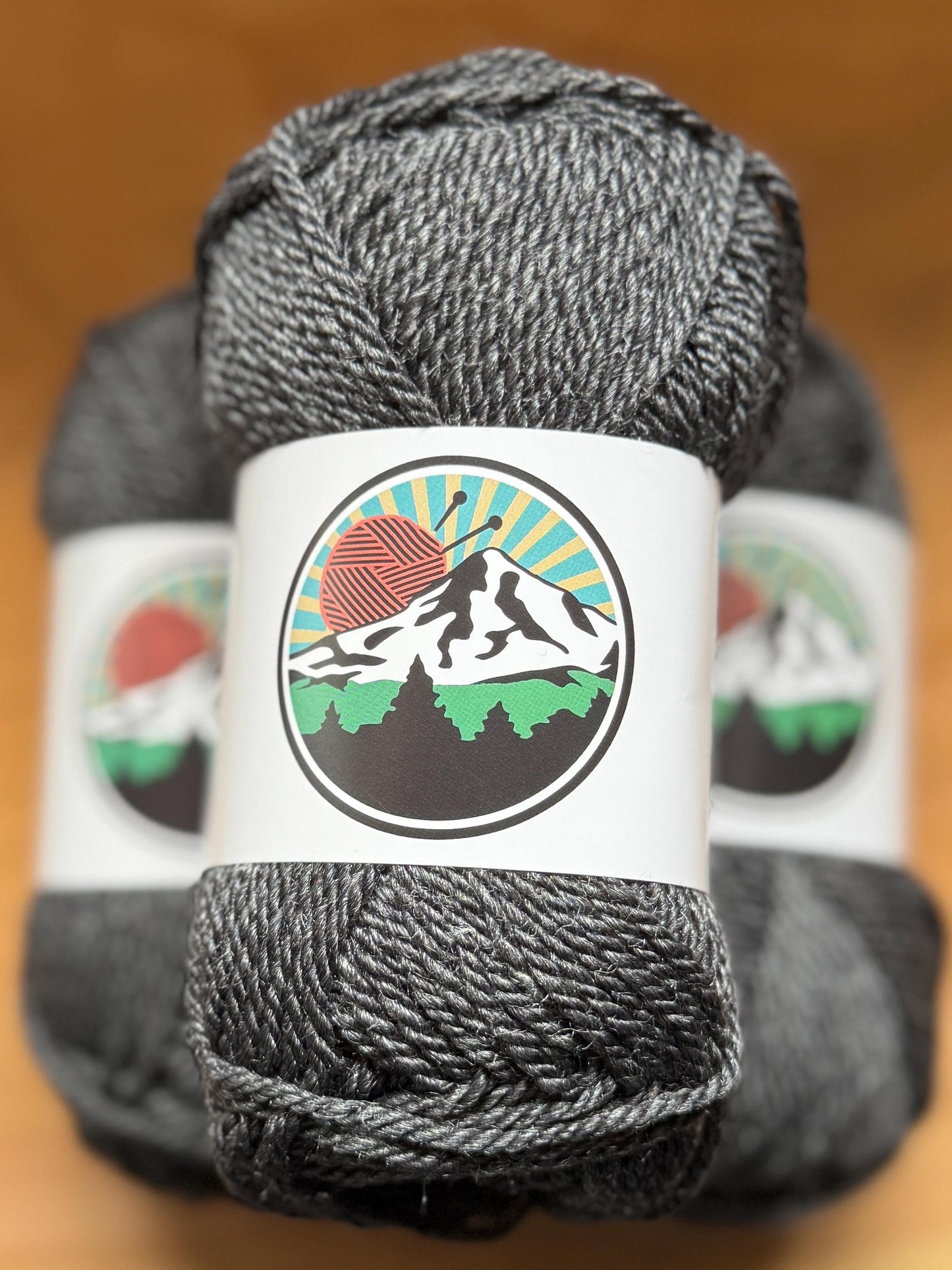 DK weight yarn. Merino Wool and Tussah Silk Blend. 50g. 120 yards. Obsidian Ridge