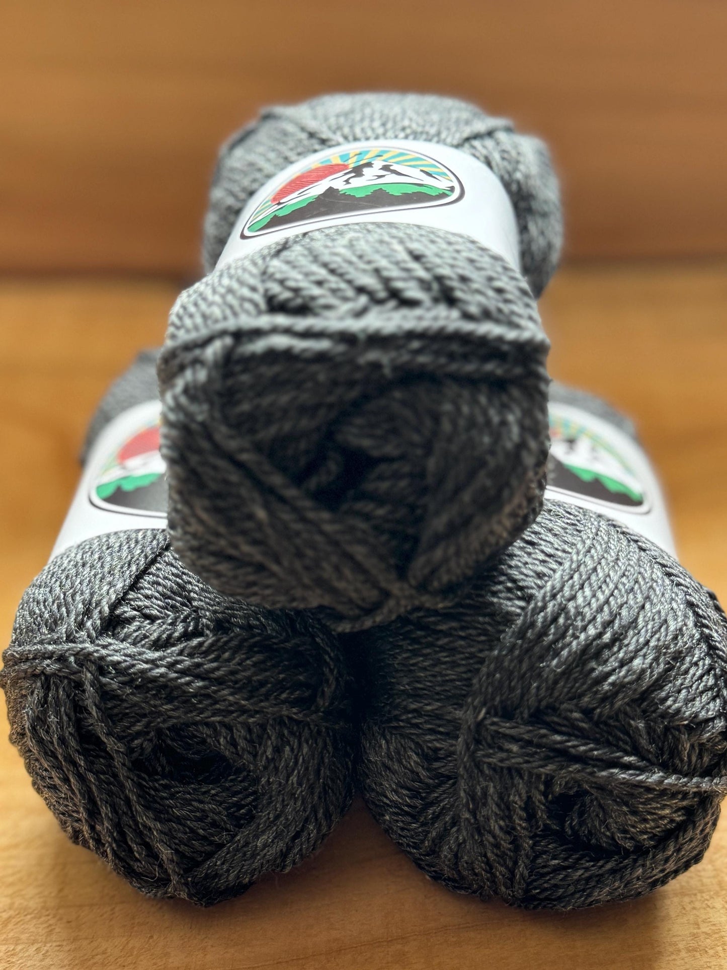 DK weight yarn. Merino Wool and Tussah Silk Blend. 50g. 120 yards. Obsidian Ridge