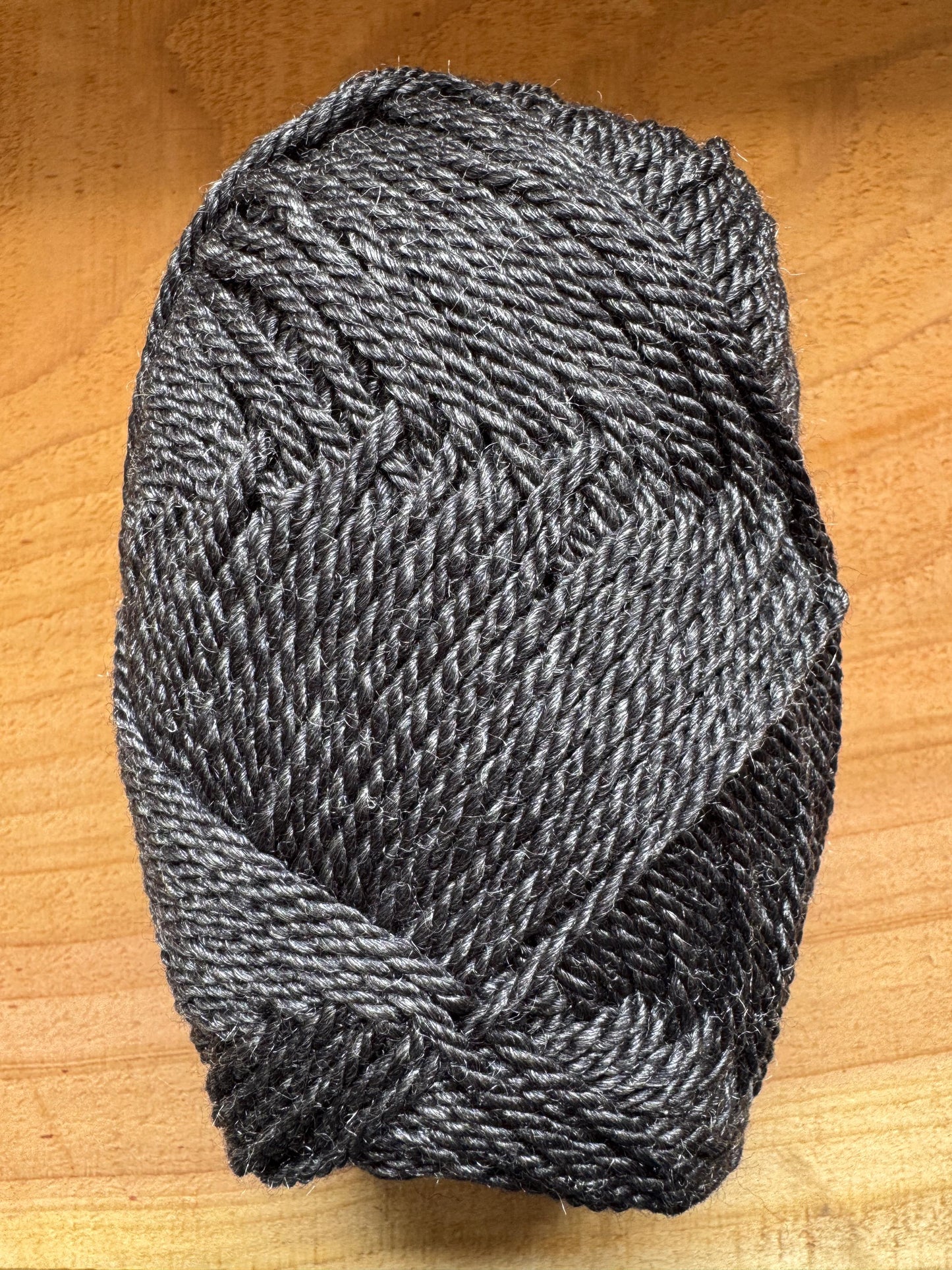 DK weight yarn. Merino Wool and Tussah Silk Blend. 50g. 120 yards. Obsidian Ridge