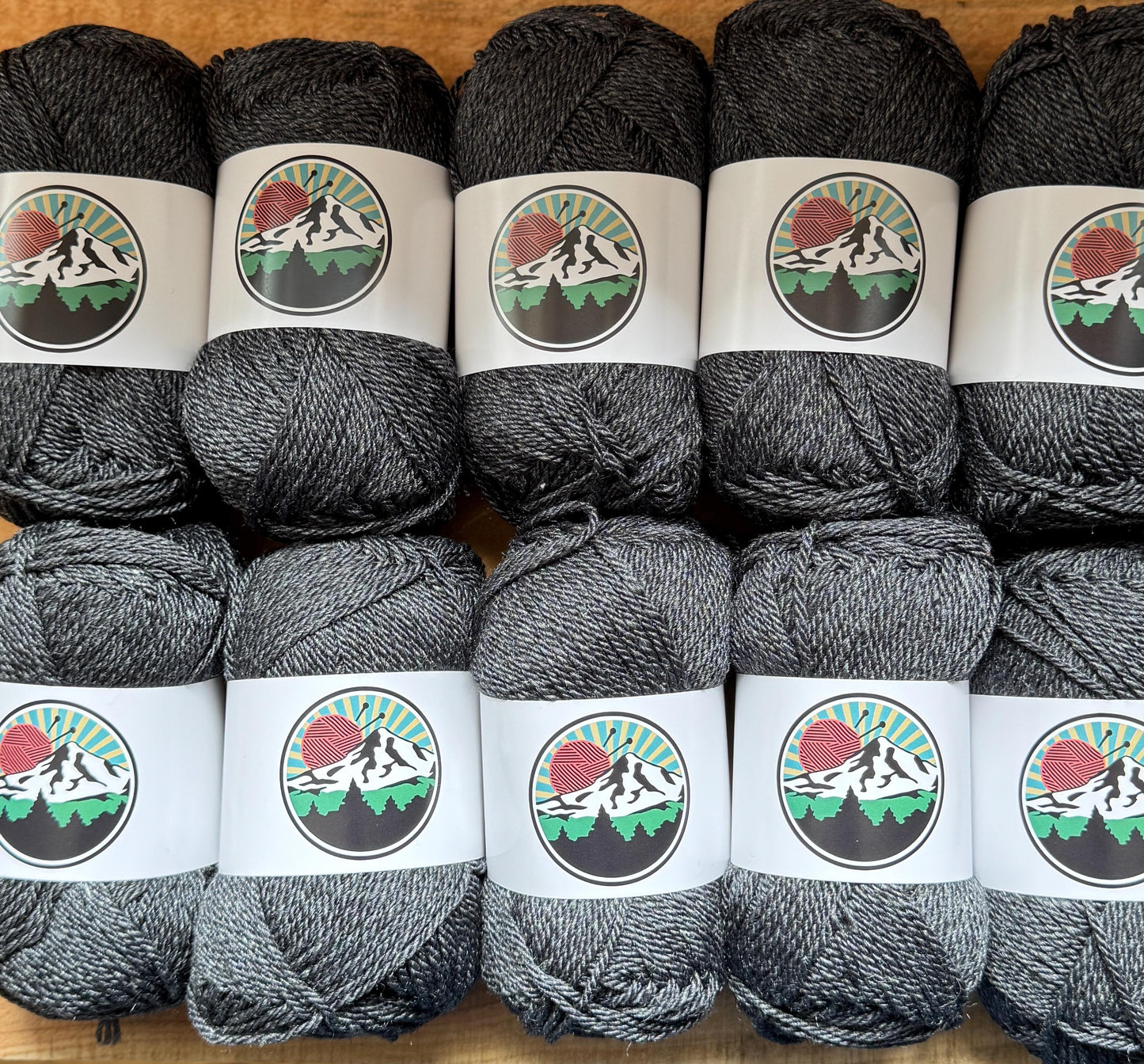 DK weight yarn. Merino Wool and Tussah Silk Blend. 50g. 120 yards. Obsidian Ridge
